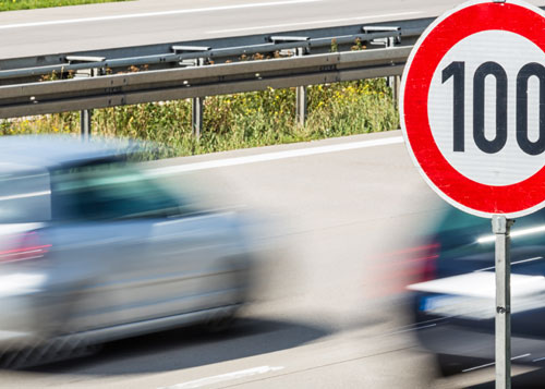 Car driving on the road with speed limiter.